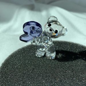 Swarvoski Bear Statue Holding a Purple 9